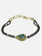 Women's Black Gold-Toned Gold-Polished Kundan Studded Charm Mangalsutra Bracelet - Ruby Raang | Grocsy