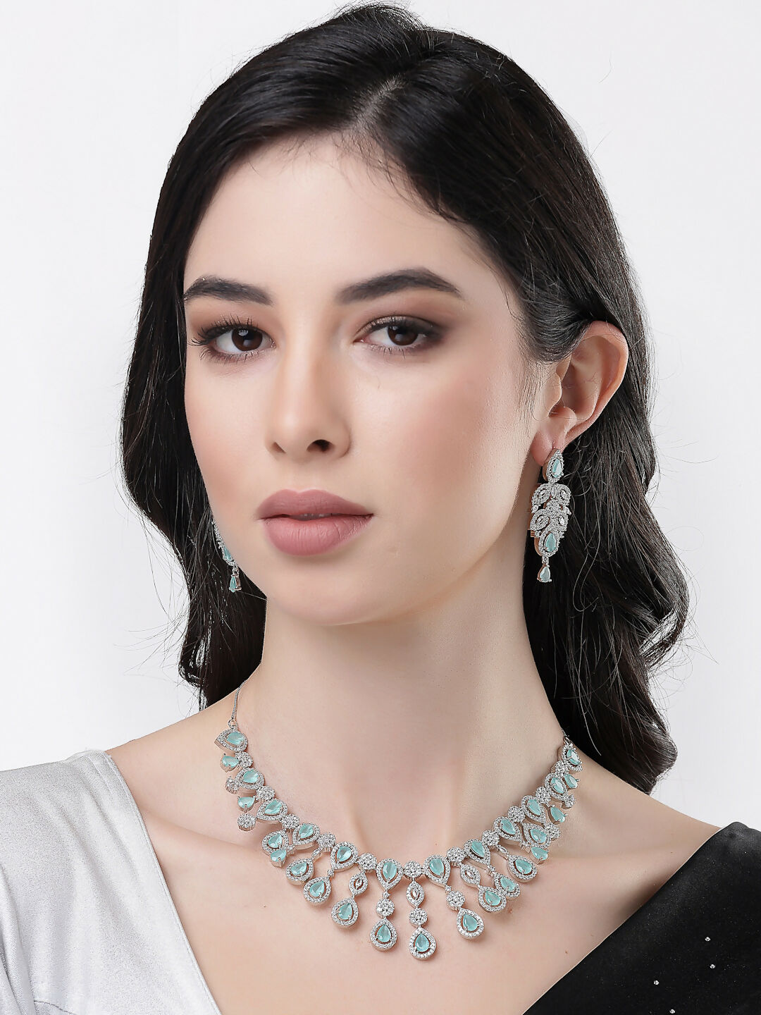 NVR Women's silver plated Turquoise CZ stone handcrafted jewellery set | Grocsy