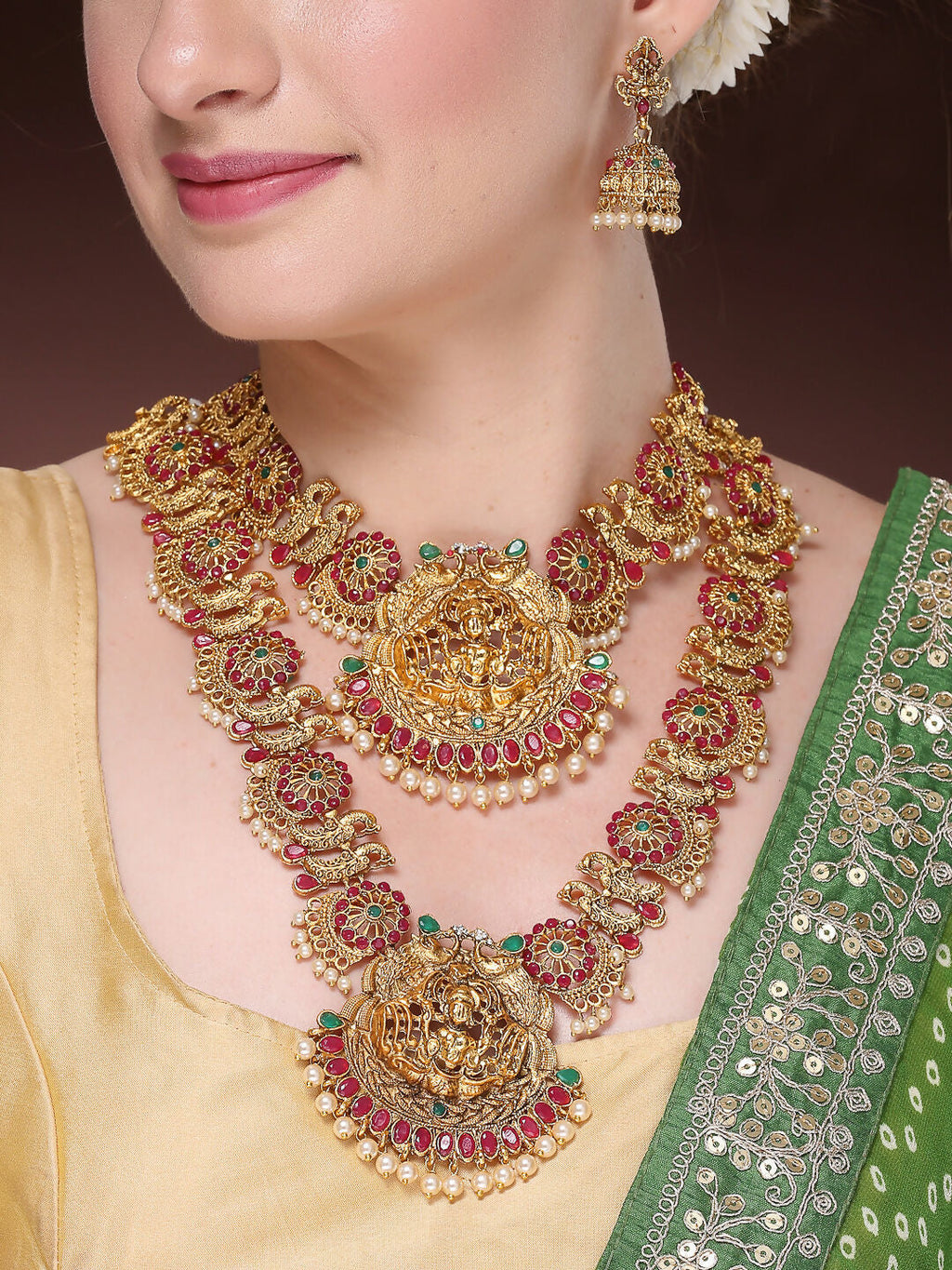NVR Women's Set of 2 Gold-Polished Green & Pink Stone Studded Peacock & Lakshmi Design Temple Jewellery Set | Grocsy
