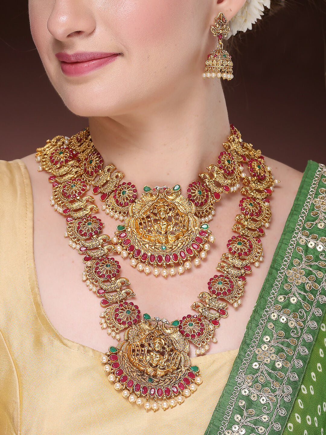 NVR Women's Set of 2 Gold-Polished Green & Pink Stone Studded Peacock & Lakshmi Design Temple Jewellery Set | Grocsy