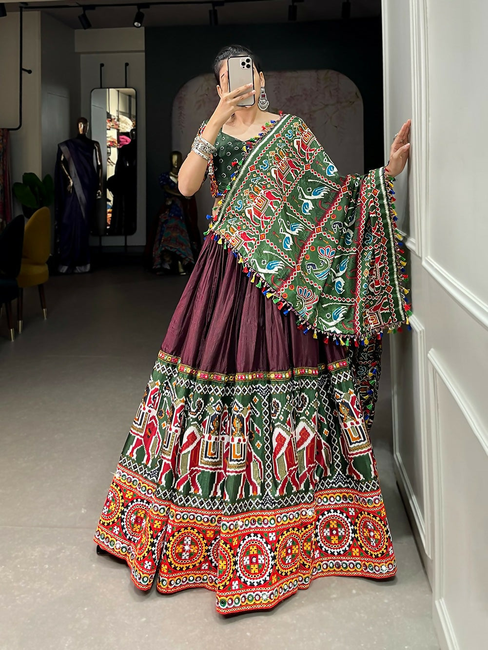 Vastranavya Navaratri Special Dola Silk Patola Print With Gamthi Work and Mirror Work Lace Border - Brown | Grocsy