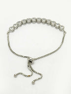 NVR Women Silver-Plated American Diamond Studded Rakhi With Roli Chawal | Grocsy