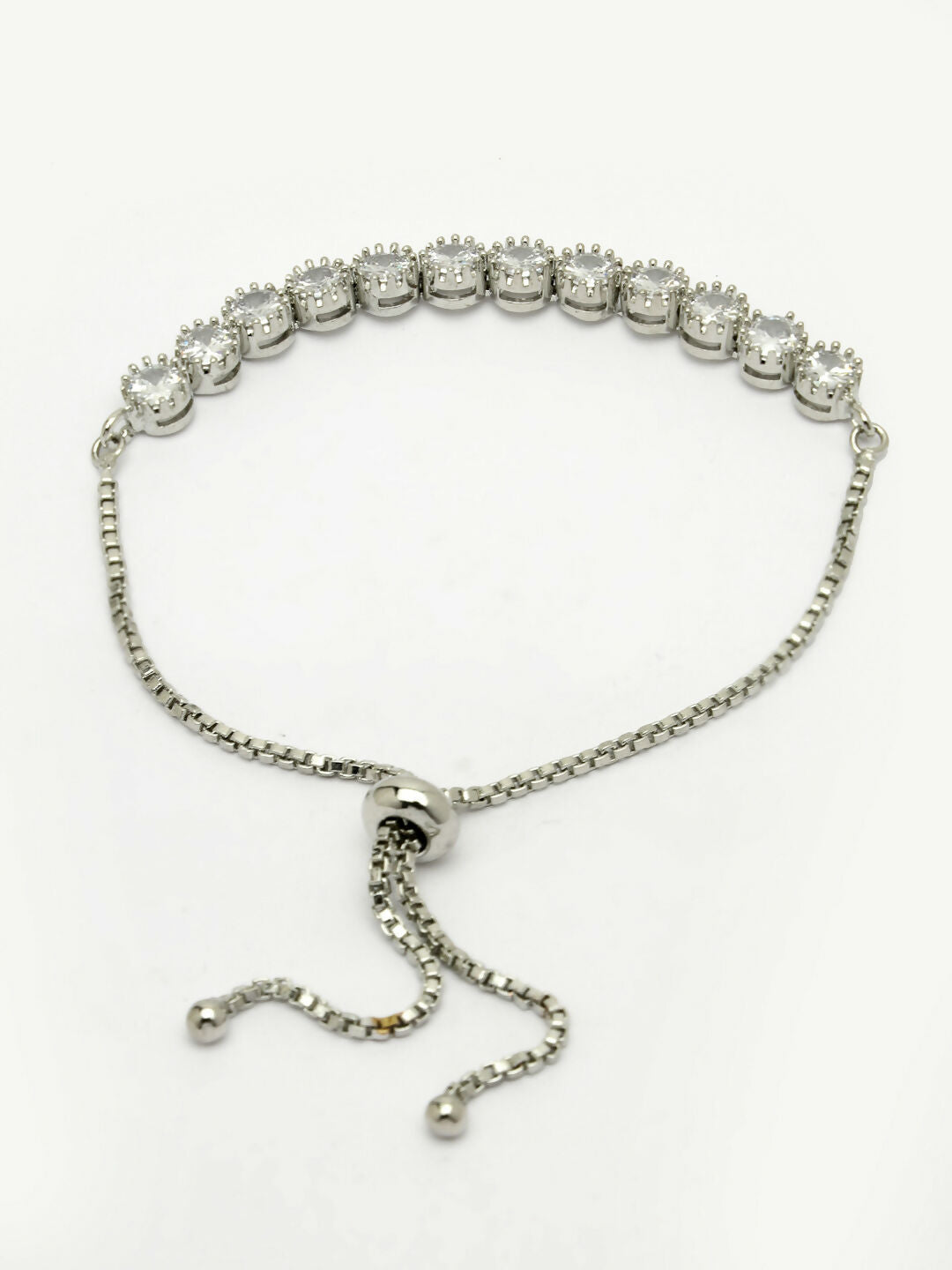 NVR Women Silver-Plated American Diamond Studded Rakhi With Roli Chawal | Grocsy