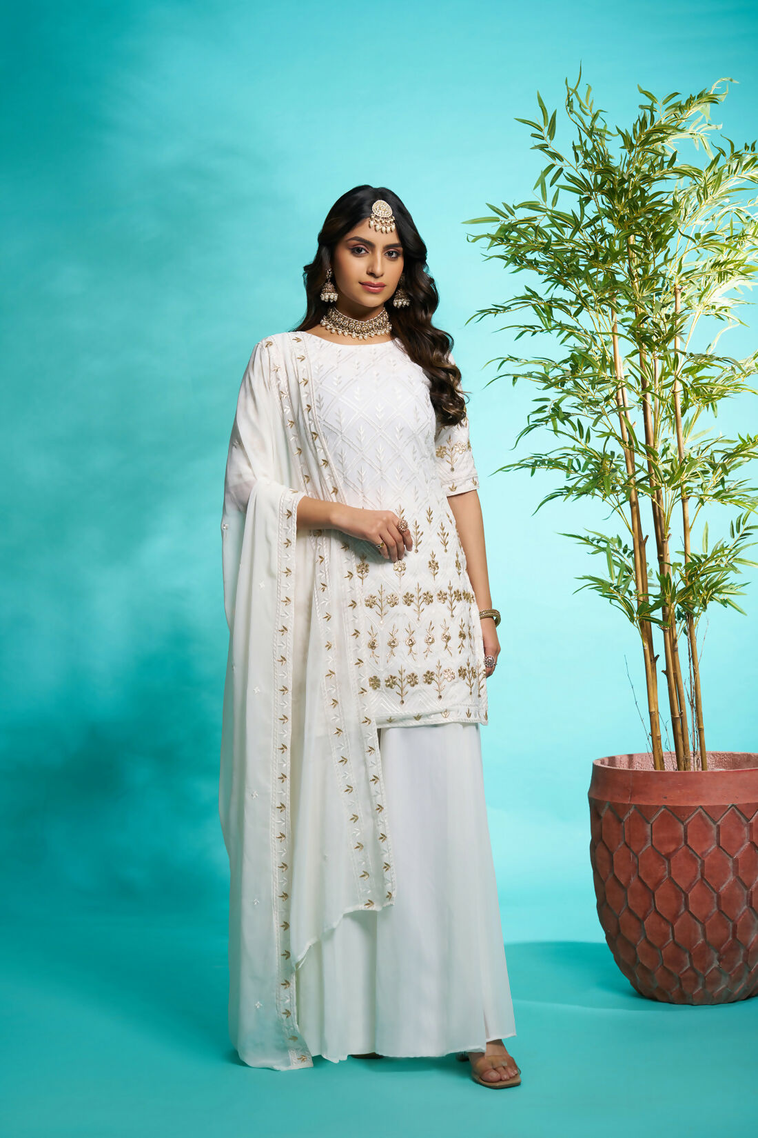 Aayaa Designer Faux Gorgette Embroidery Zari Sequins Thread work Full Flaired plazzo Suit with Dupatta - Off White | Grocsy