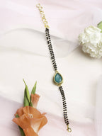 Women's Black Gold-Toned Gold-Polished Kundan Studded Charm Mangalsutra Bracelet - Ruby Raang | Grocsy