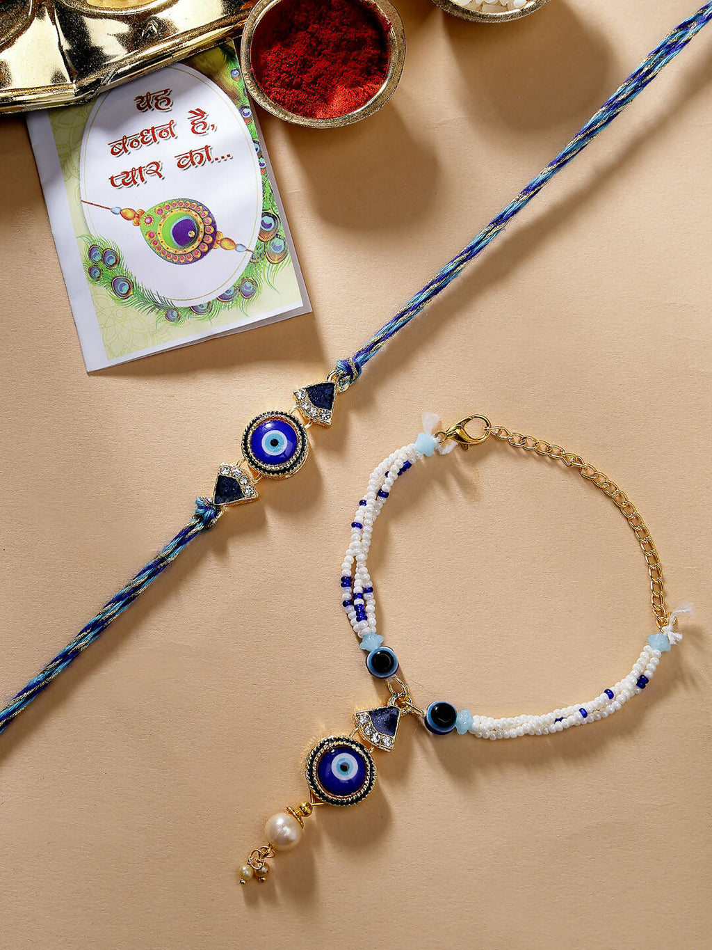 NVR Women & Men Set of 2 Blue Evil Eye Bhaiya Bhabhi Rakhi With Roli Chawal | Grocsy