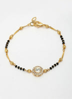 NVR Women Gold-Polished & Black Brass AD-Studded Hand Mangalsutra Link Bracelet