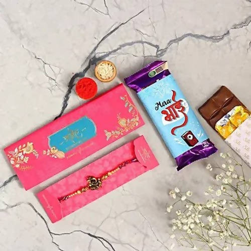 Ganesha Rakhi & Cadbury Silk In Mera Bhai Sleeve | Grocsy