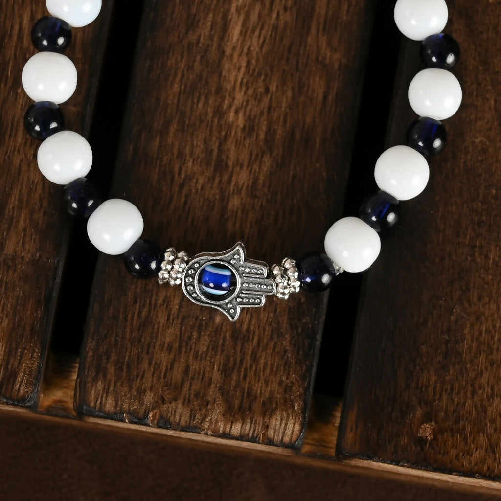NVR Women & Men Black & White Evil Eye Elasticated Rakhi With Roli Chawal | Grocsy