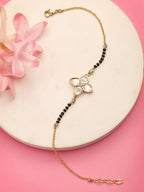 NVR Women Gold-Polished & Black Brass Stone-Studded Hand Mangalsutra Link Bracelet | Grocsy