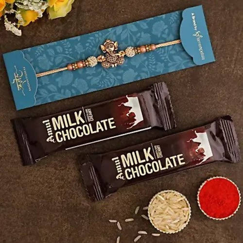 Enticing Ganesha Rakhi & Amul Milk Chocolate Flow Wraps | Grocsy