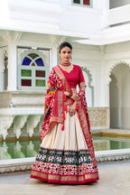 Evanik Off White Traditional Style Tussar Silk Patola Print With Foil Work Unstitched Lehenga Choli | Grocsy