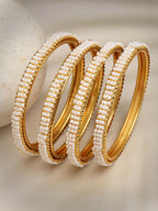 NVR Women's Set of 4 Gold-Polished Pearl Handcrafted Traditional Bangles | Grocsy
