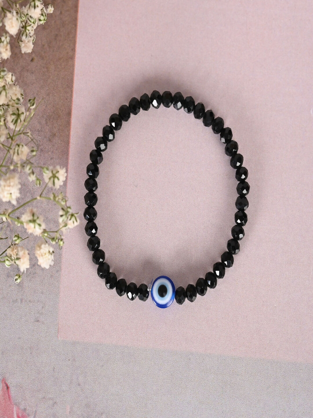 NVR Women & Men Black Evil Eye Elasticated Rakhi With Roli Chawal | Grocsy