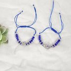 NVR Women & Men Set of 2 Blue Evil Eye Rakhi With Roli Chawal | Grocsy