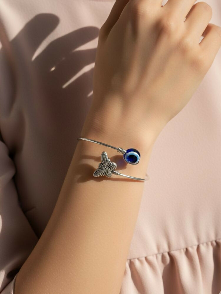 NVR Women Rhodium Plated Evil Eye Kada Bracelet | Grocsy