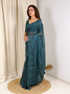 Evanik Teal Glass Satin Jecquard Weaving With Thread Sequence Work Saree With Blouse | Grocsy