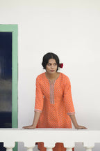 Orange Cotton Floral Printed A line Kurta - Prasuti | Grocsy