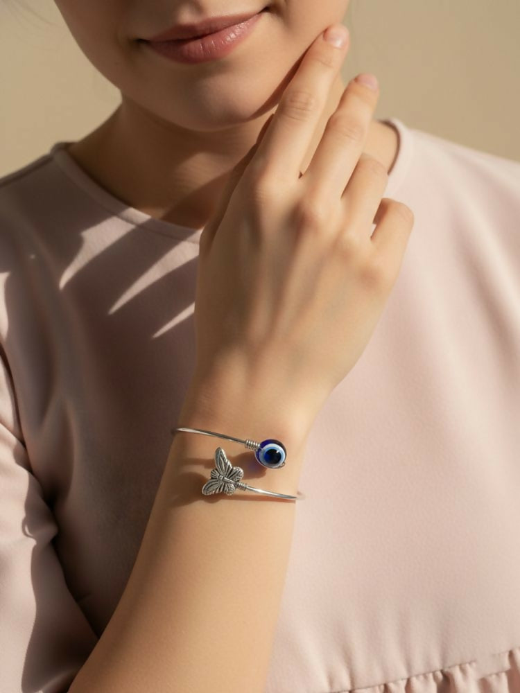 NVR Women Rhodium Plated Evil Eye Kada Bracelet | Grocsy