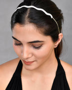 VOJ Silver Plated AD Studded Wave Shaped Hairband | Grocsy