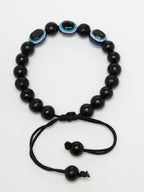 NVR Women & Men Black Evil Eye Rakhi With Roli Chawal | Grocsy