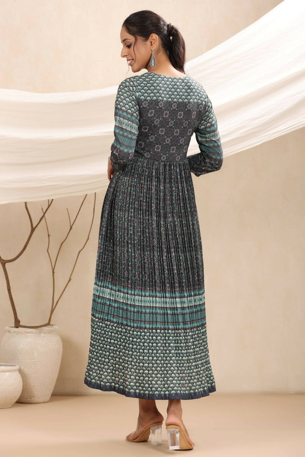Juniper Bottle Green Muslin Festive Printed Flared Dress For Women | Grocsy