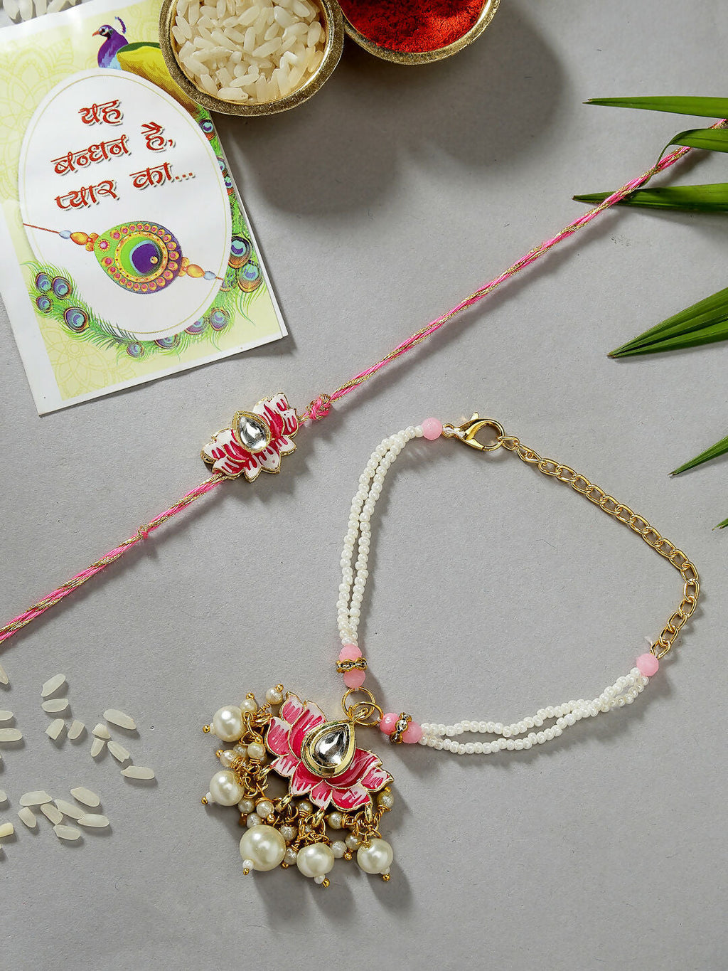 NVR Women & Men Set of 2 Pink Lotus Shape Kundan-Studded & Beaded Handcrafted Wraparound Rakhi Set With Roli Chawal | Grocsy