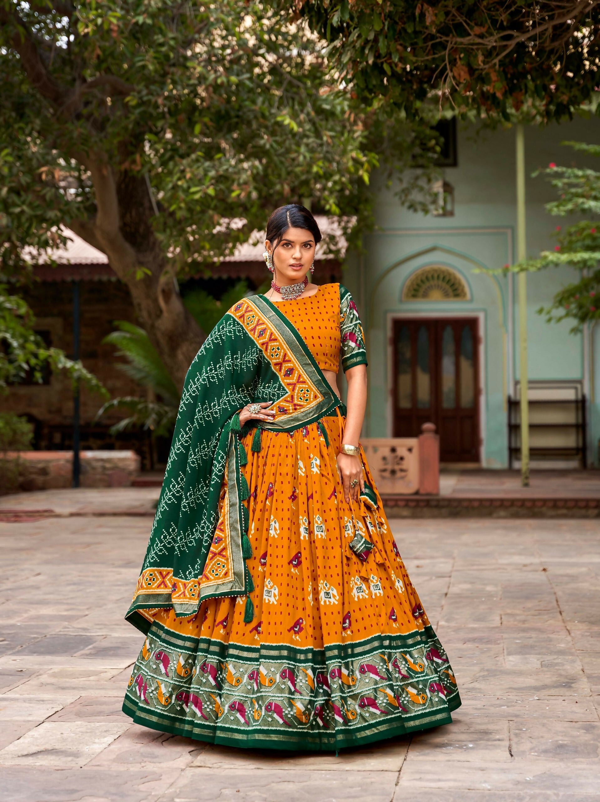 Vastranavya Patola Printed and Foil Work Tussar Silk Lehenga with Unstitched Blouse - Mustard | Grocsy