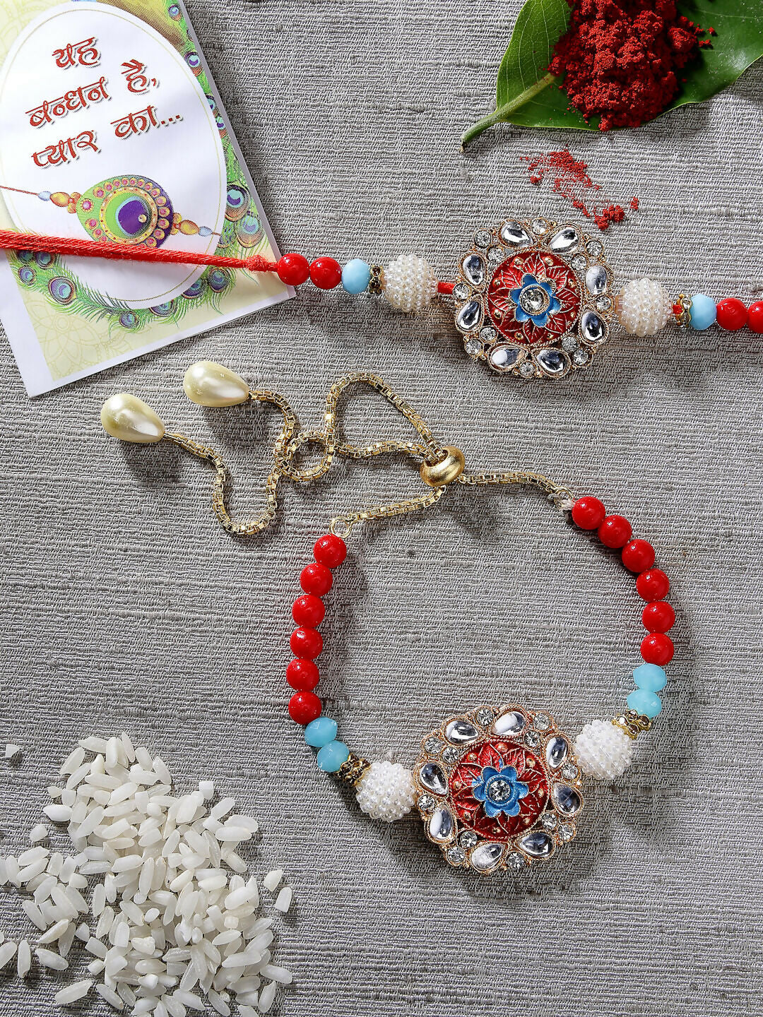 NVR Women & Men Set of 2 Red-colored Stone-Studded & Beaded Bhaiya Bhabhi Rakhi With Roli Chawal & Chocolate | Grocsy
