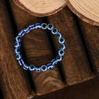 NVR Men & Women Black & Blue Evil Eye Elasticated Bracelet | Grocsy