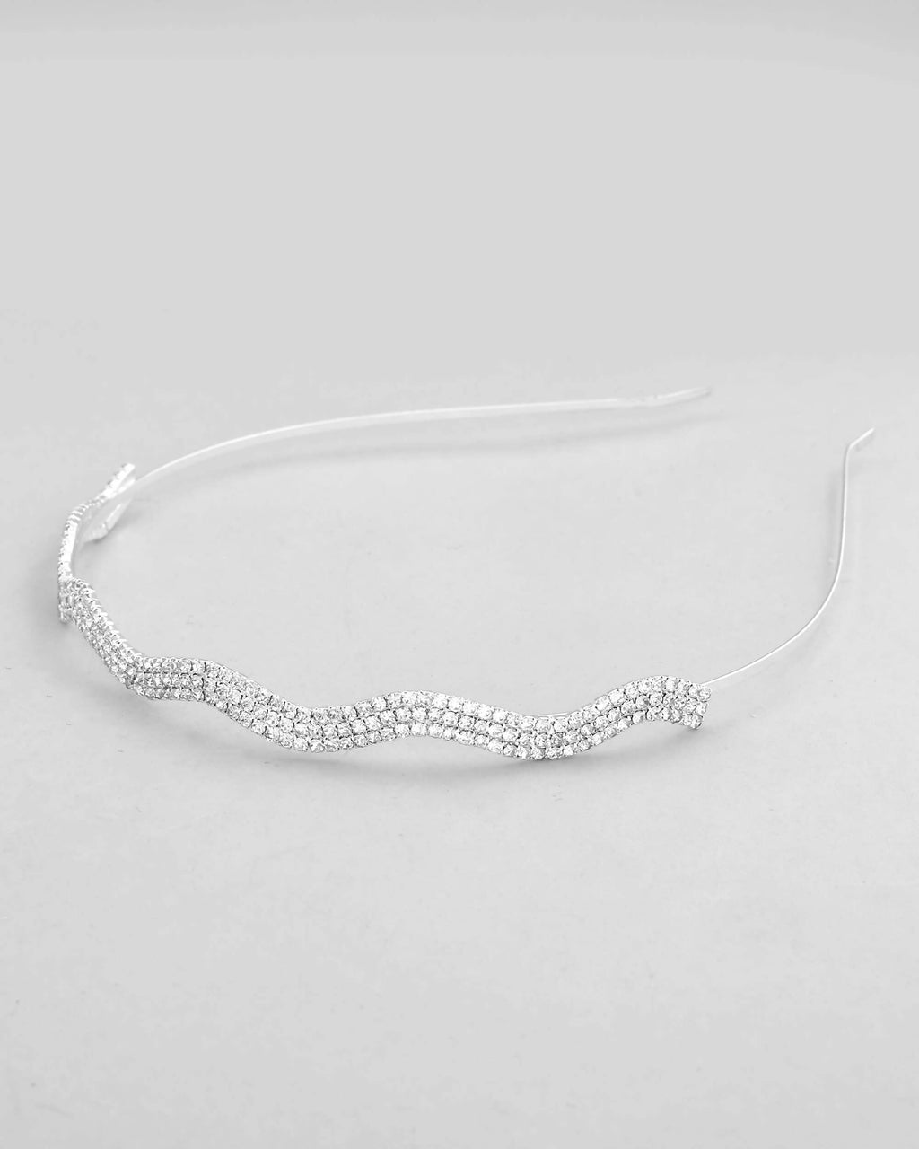 VOJ Silver Plated AD Studded Wave Shaped Hairband | Grocsy