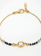NVR Women Gold-Polished & Black Brass Stone-Studded Hand Mangalsutra Link Bracelet | Grocsy