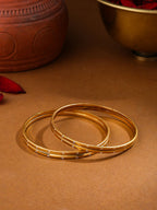 NVR Women's Set of 4 Gold-Polished Traditional Bangles | Grocsy