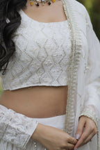 Vastranavya Faux Georgette With Sequins & Thread Embroidered Work Lehenga Choli - White | Grocsy
